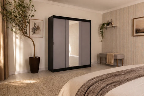 Clóset matrimonial Reno negro con tres puertas corredizas y espejo central en recámara amplia